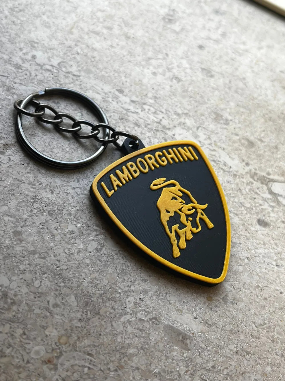 NiccieNacks Lamborghini keyring featuring a detailed miniature car model attached to a keychain.