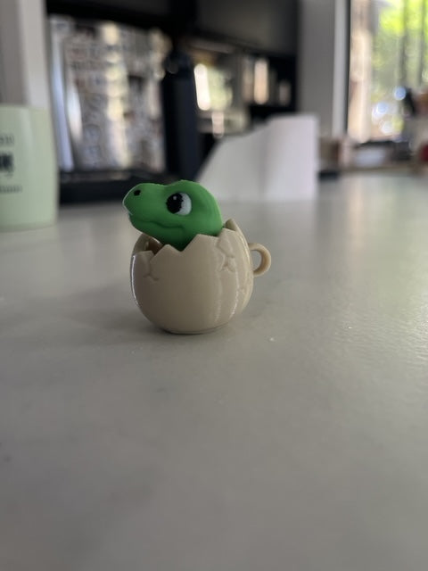 NiccieNacks Dinosaur Egg Fidget Clicker with textured dinosaur egg design, perfect for stress relief and tactile play.