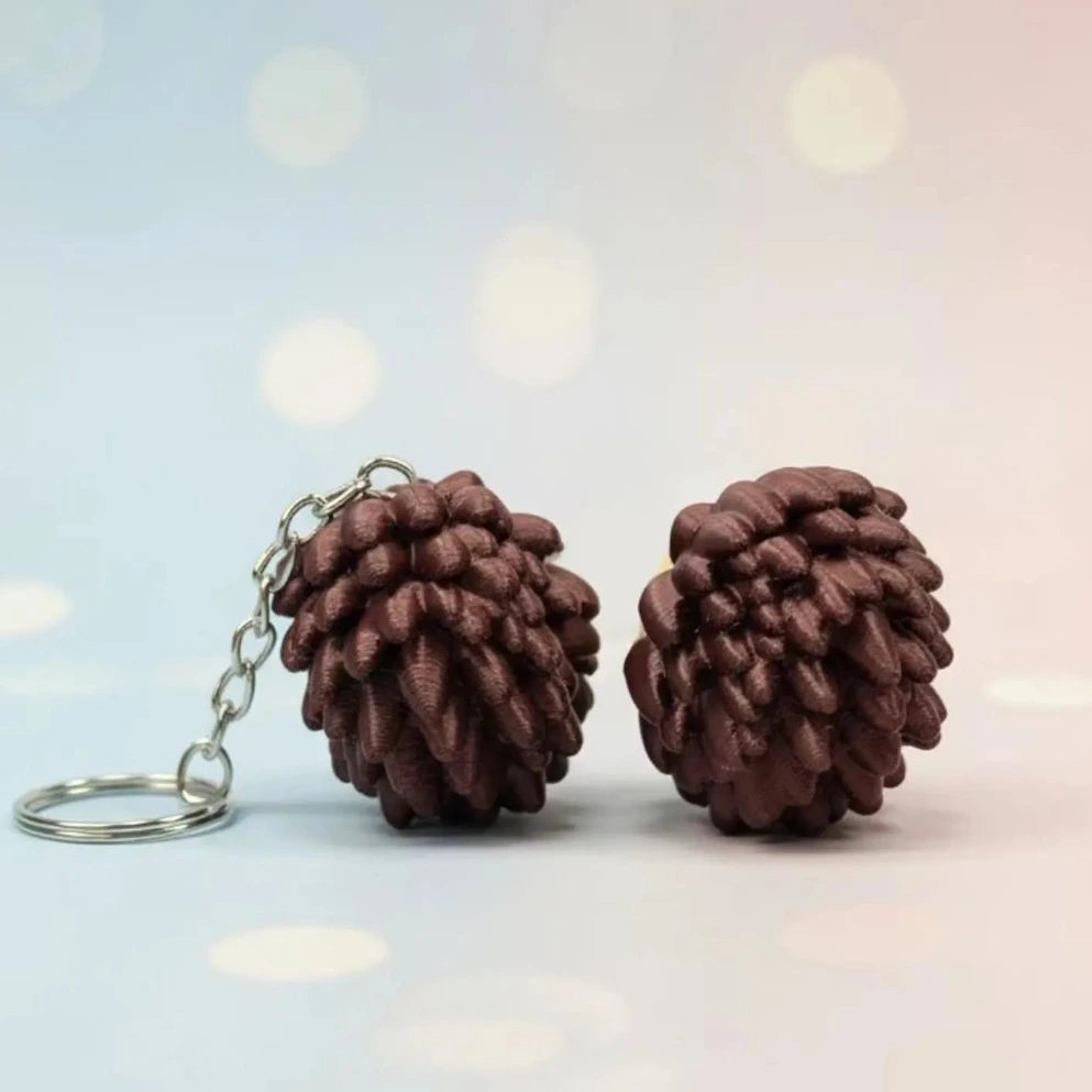 3D printed hedgehog keychain fidget clicker with textured woodland animal charm, made by NiccieNacks