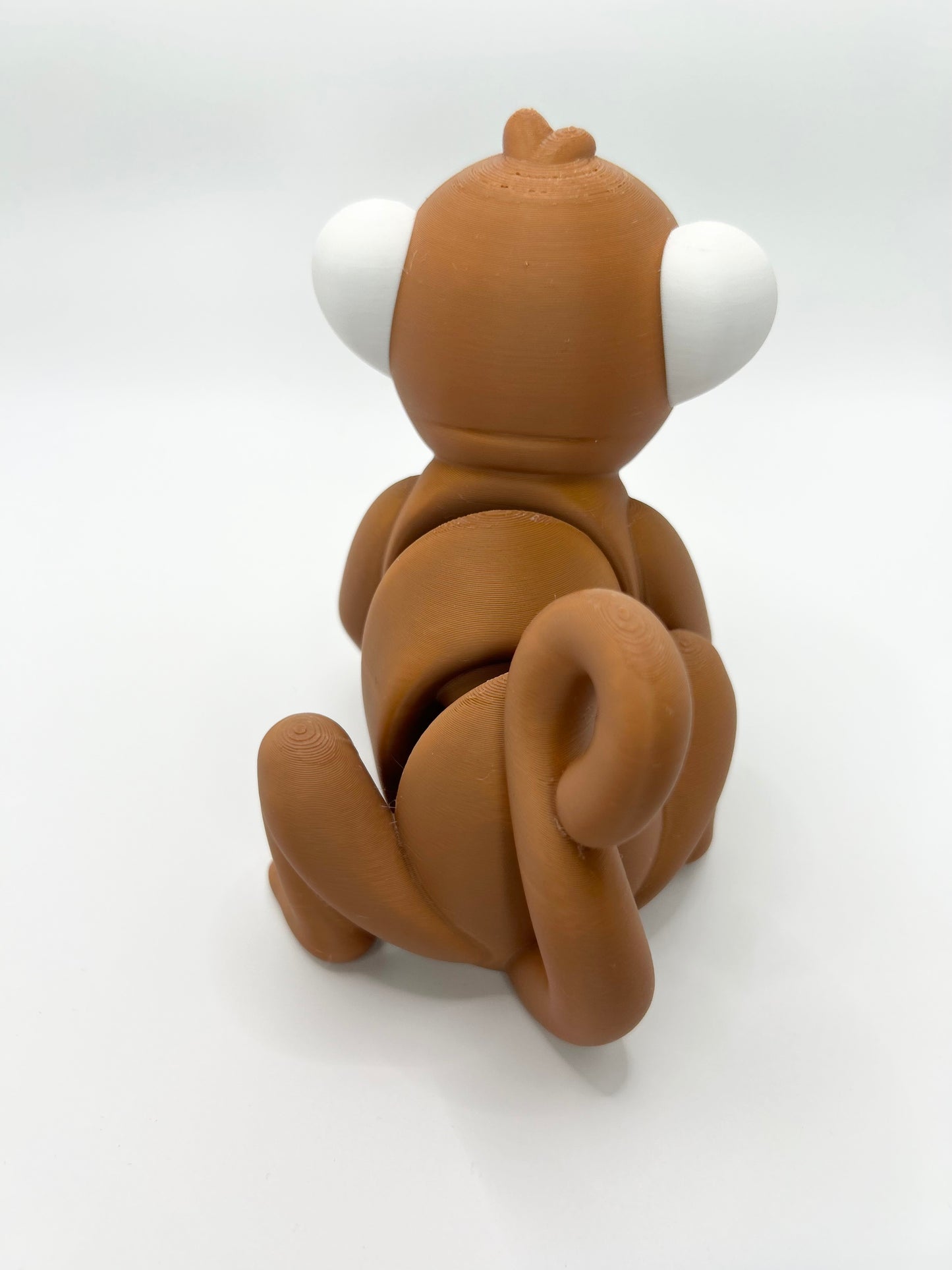Articulated Monkey Wiggies Toy by NiccieNacks featuring colorful, flexible monkey figure with animated pose and detailed facial features.