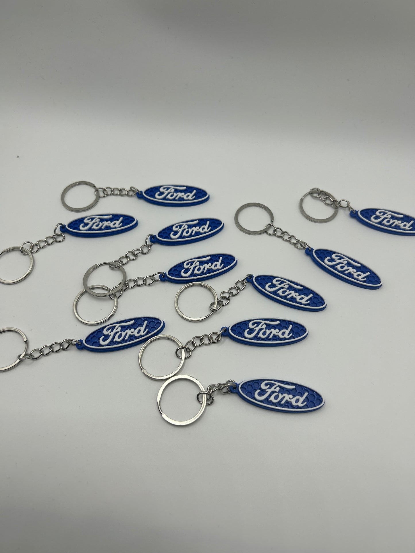 NiccieNacks Ford logo car keyring with metal keychain featuring the iconic blue Ford emblem design.