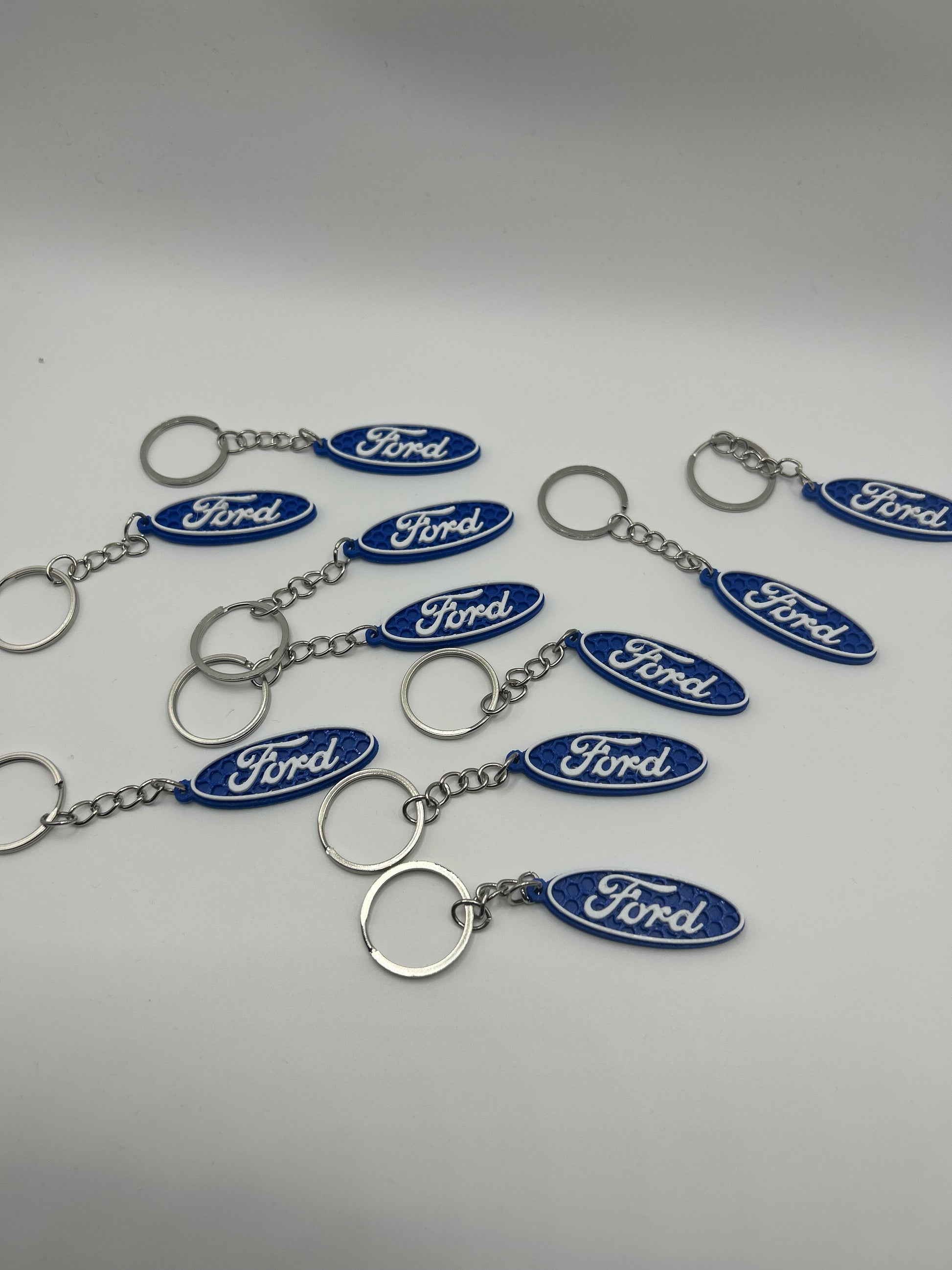 NiccieNacks Ford logo car keyring with metal keychain featuring the iconic blue Ford emblem design.