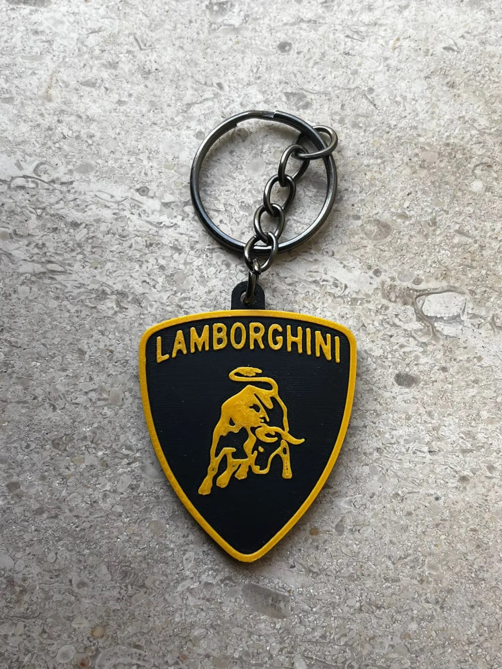 NiccieNacks Lamborghini keyring featuring a detailed miniature car design on a sleek keychain.