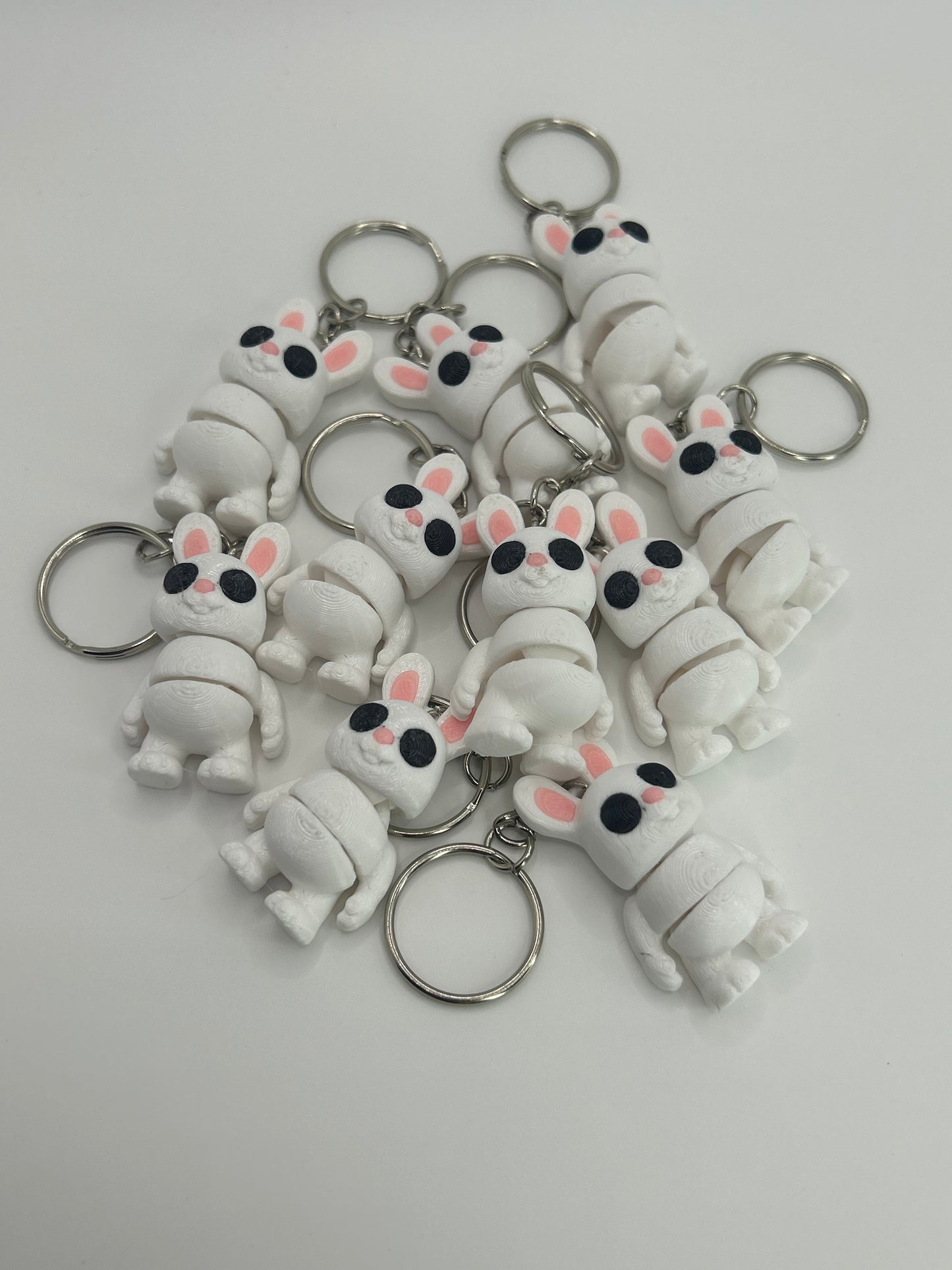 NiccieNacks Bunny Rabbit Articulated Flexi Wiggies toy or keychain showing a cute, flexible bunny figure with vibrant colors.