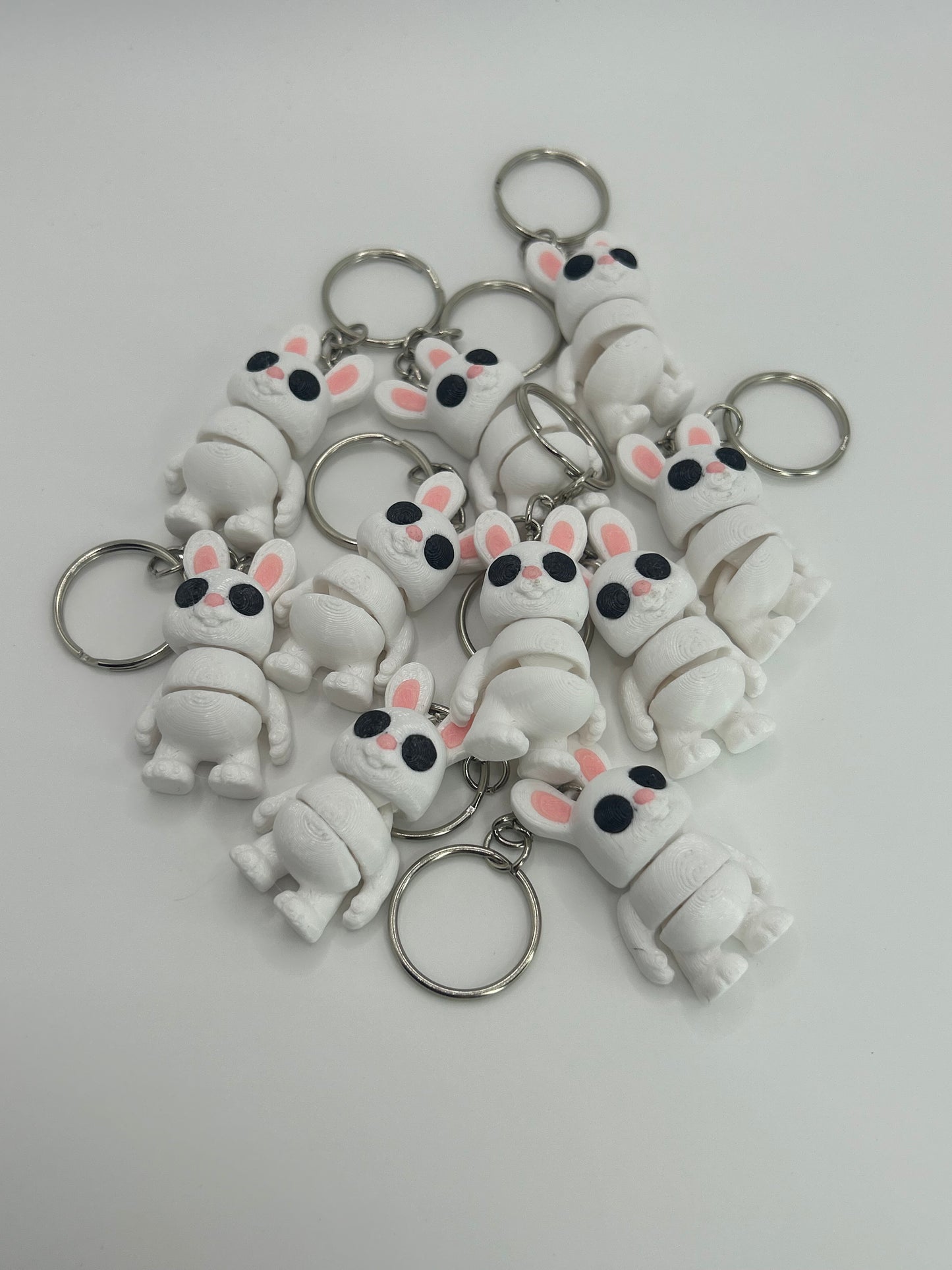 Colorful Bunny Rabbit Wiggies articulated toy and keychain from NiccieNacks, featuring flexible, playful bunny design.