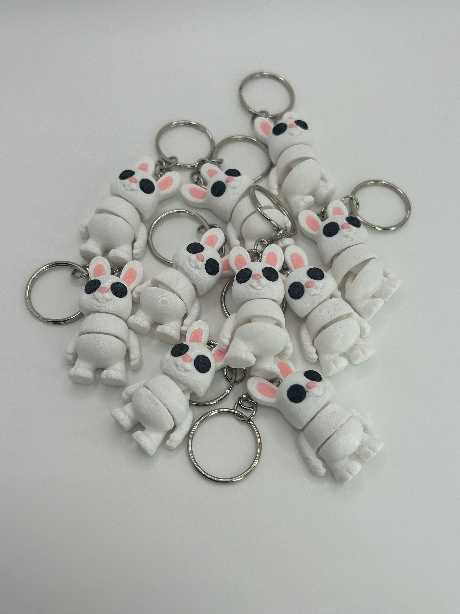 Colorful Bunny Rabbit Wiggies articulated toy and keychain from NiccieNacks, featuring flexible, playful bunny design.