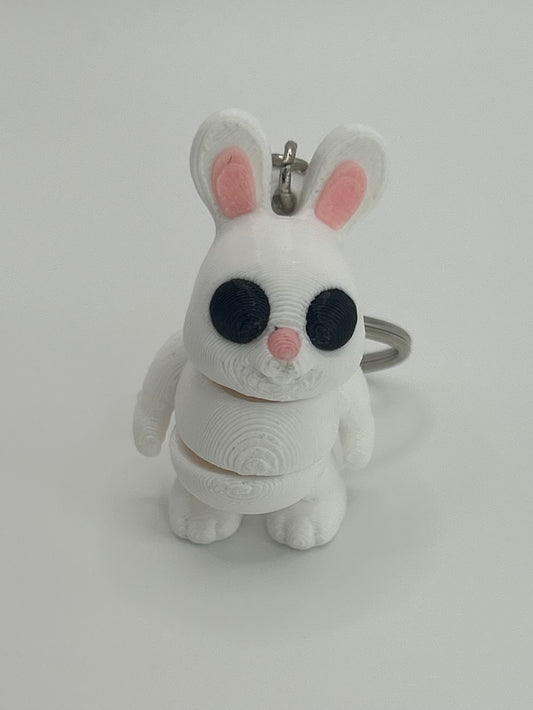 NiccieNacks Bunny Rabbit Articulated Flexi Wiggies toy keychain showing a cute, flexible bunny figure with jointed limbs.