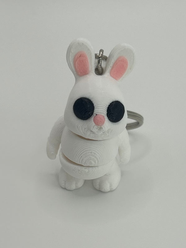 NiccieNacks Bunny Rabbit Articulated Flexi Wiggies toy keychain showing a cute, flexible bunny figure with jointed limbs.