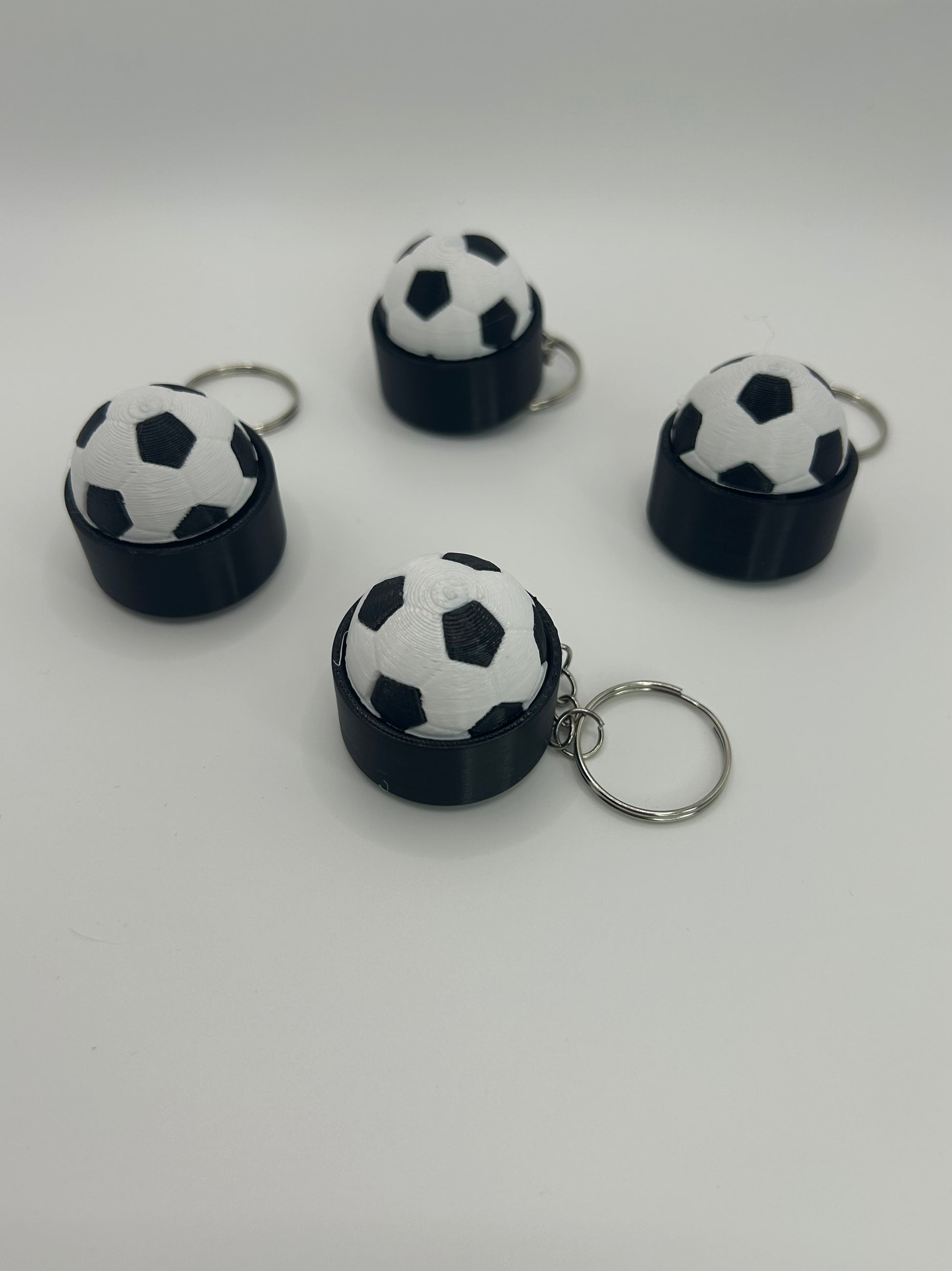 NiccieNacks World Cup football fidget clicker keyring with clickable football design and keyring attachment.