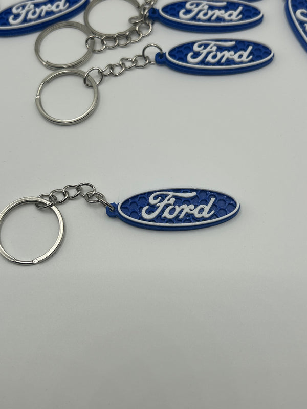 NiccieNacks Ford logo car keyring with metal keychain featuring the Ford emblem on a silver finish.