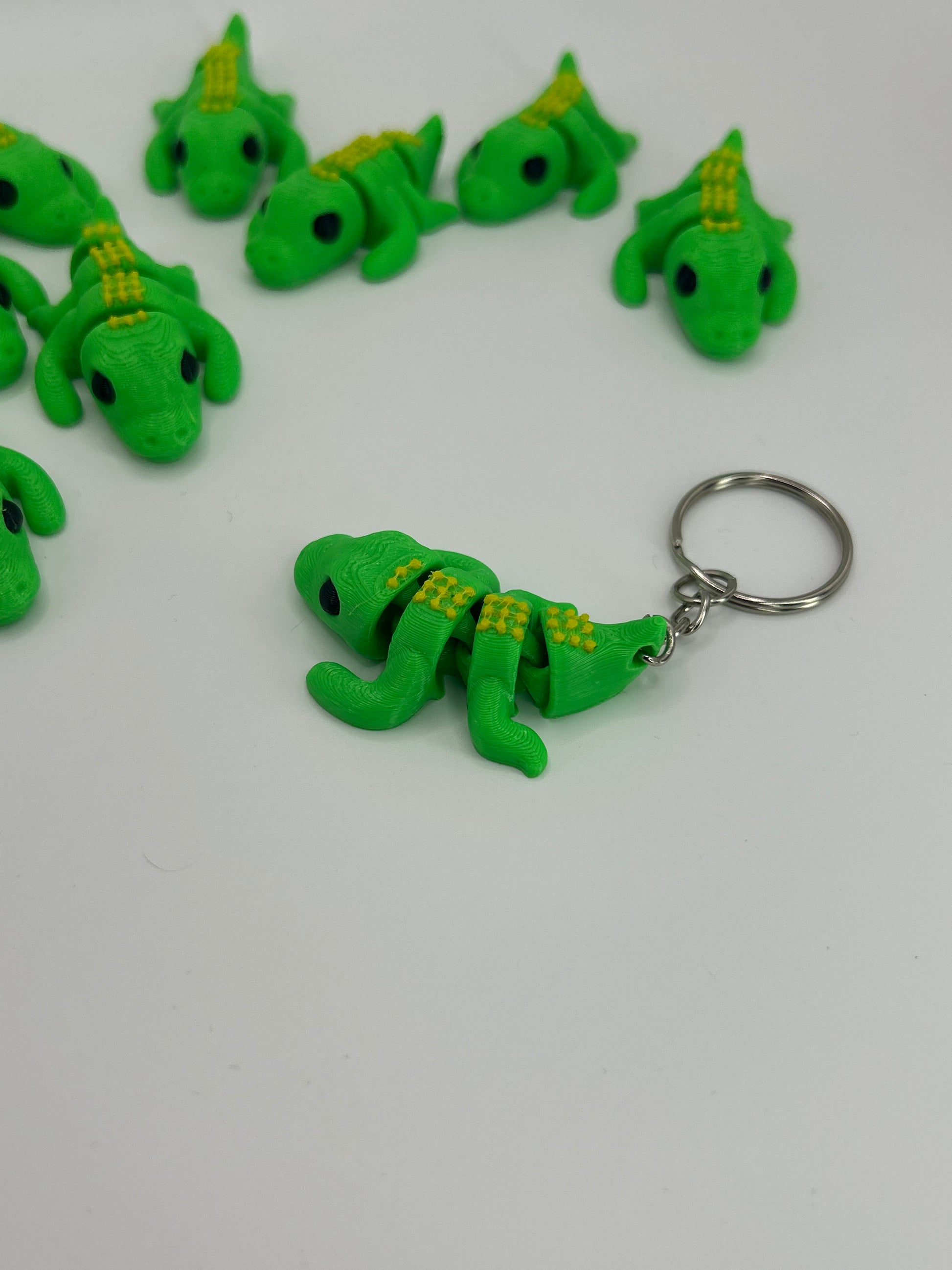 NiccieNacks Crocodile Articulated Flexi Wiggies keychain showing a detailed, flexible crocodile figure with textured scales.