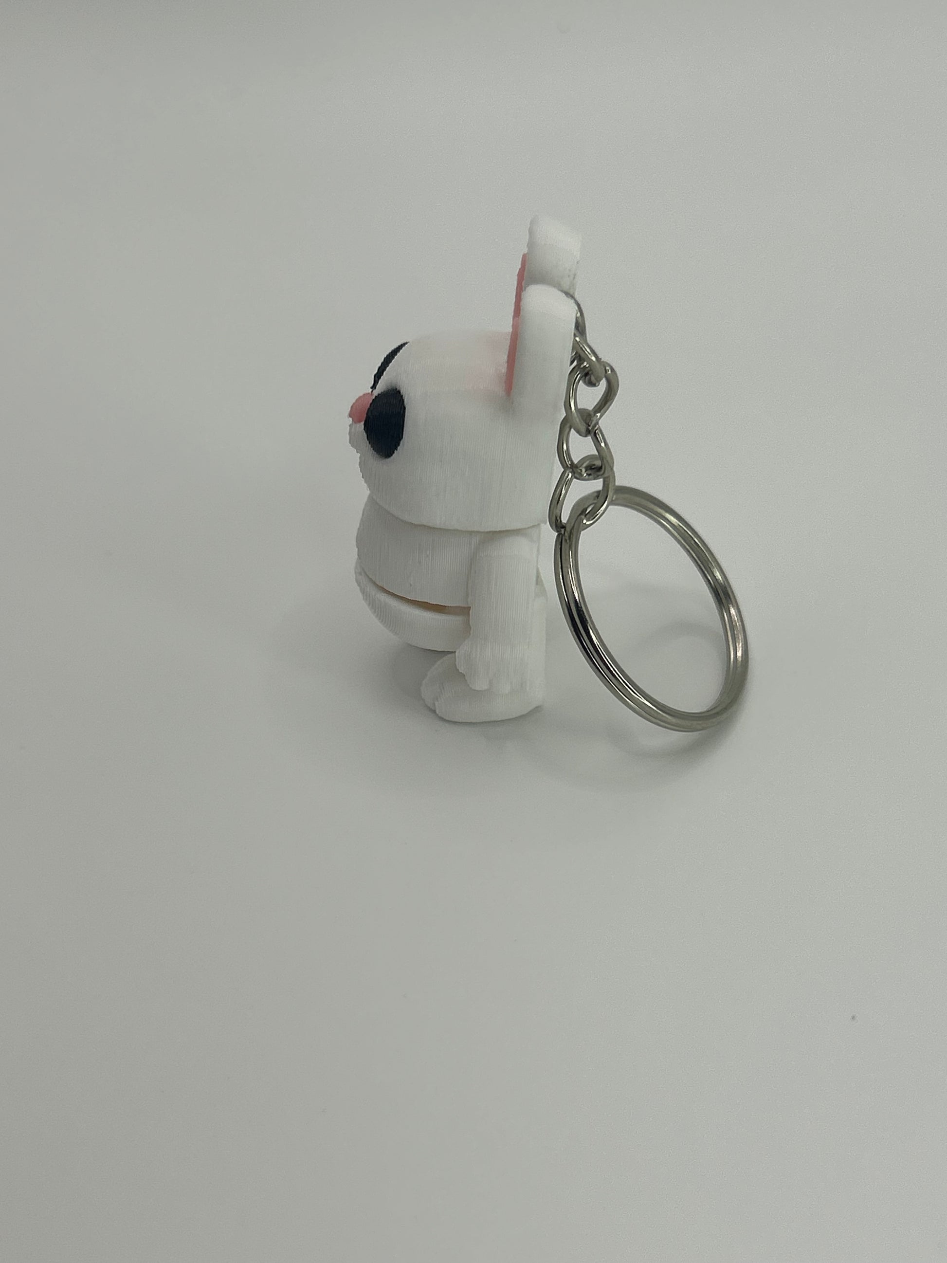 Colorful Bunny Rabbit Wiggies articulated toy and keychain by NiccieNacks, featuring flexible, jointed bunny design with vibrant details.
