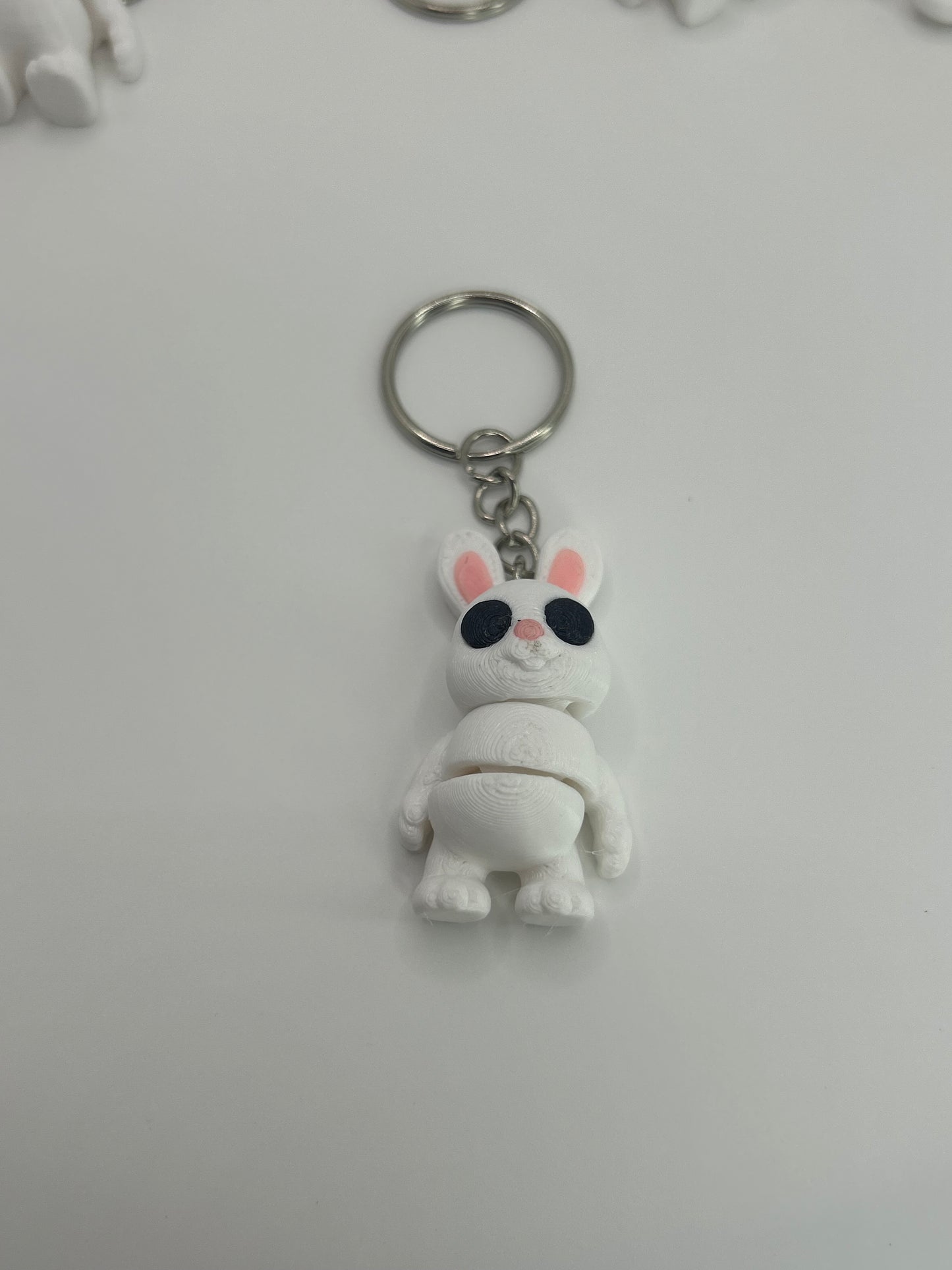 Colorful Bunny Rabbit Articulated Flexi Wiggies toy and keychain by NiccieNacks, featuring flexible limbs and detailed bunny design.