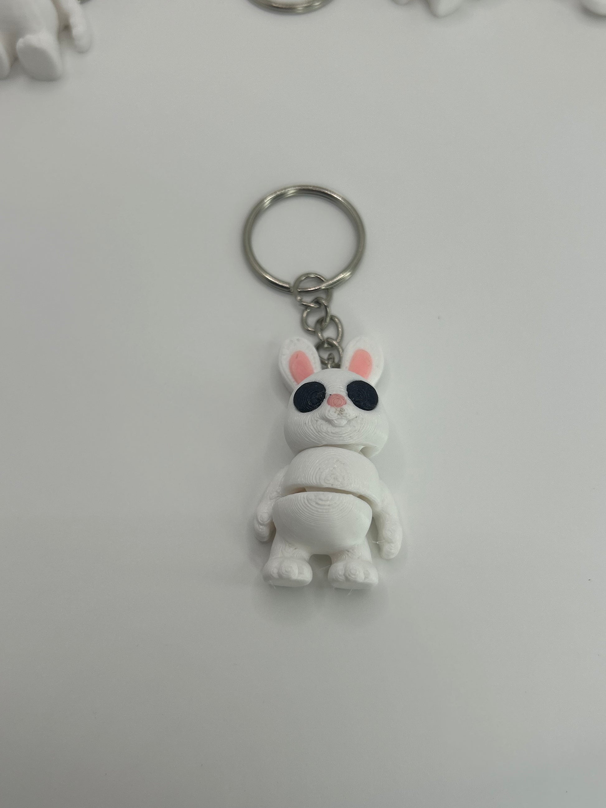 Colorful Bunny Rabbit Articulated Flexi Wiggies toy and keychain by NiccieNacks, featuring flexible limbs and detailed bunny design.