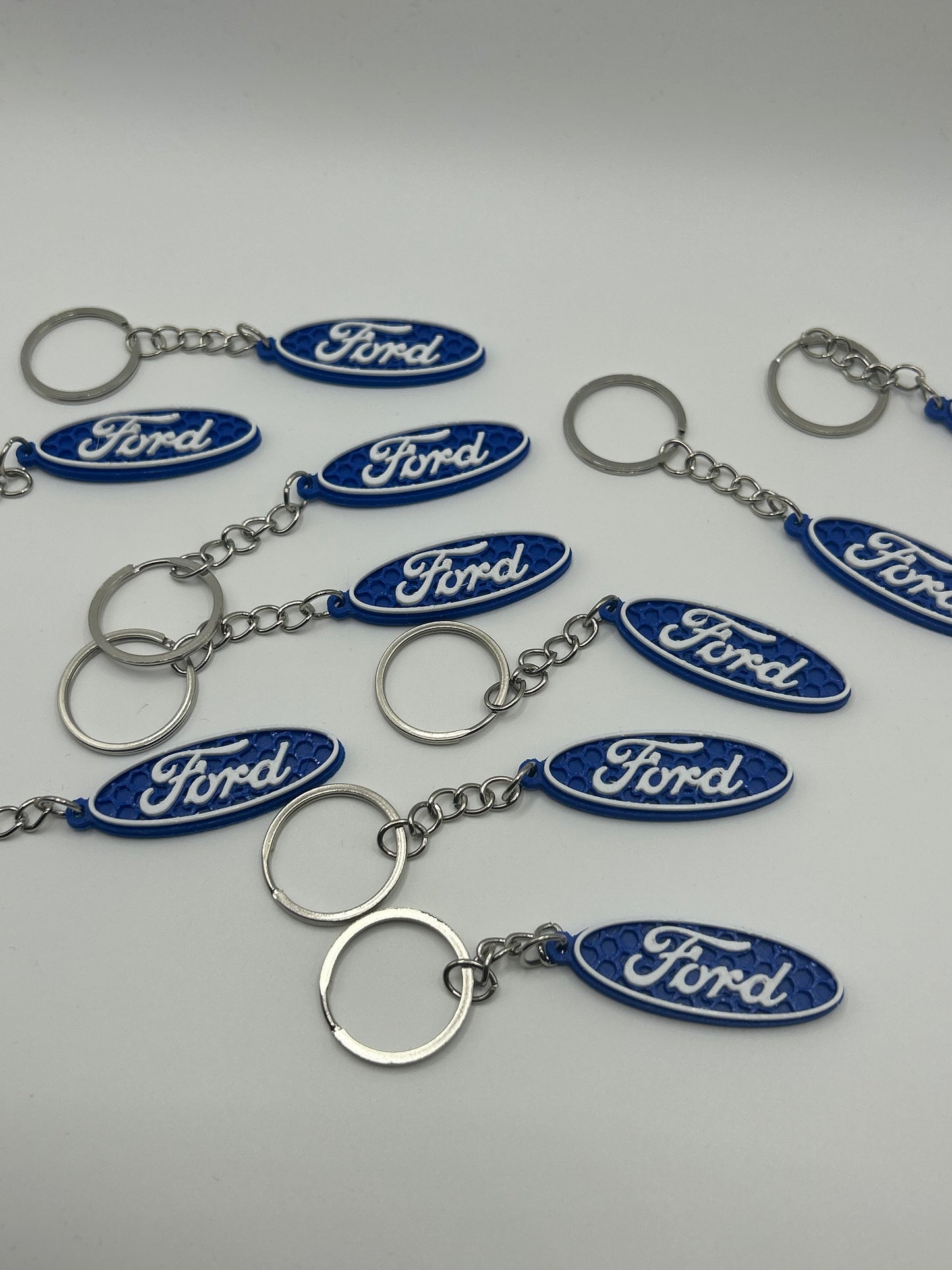 NiccieNacks Ford logo car keyring with branded metal keychain and embossed Ford emblem, ideal for car enthusiasts.
