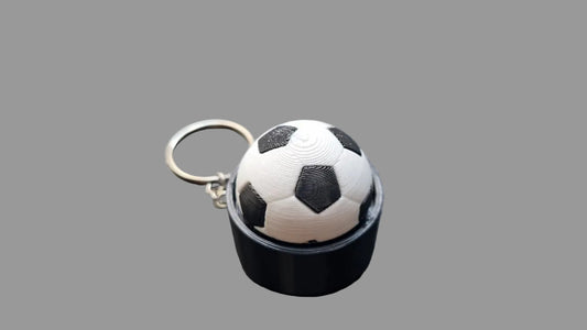 NiccieNacks World Cup football fidget clicker keyring with a miniature soccer ball design for tactile fun and stress relief.