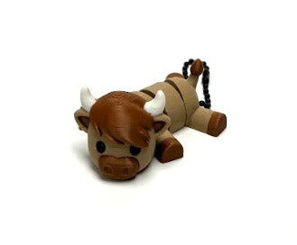 NiccieNacks Highland Cow Small Wiggies articulated toy with a cute, detailed cow figure featuring movable parts.