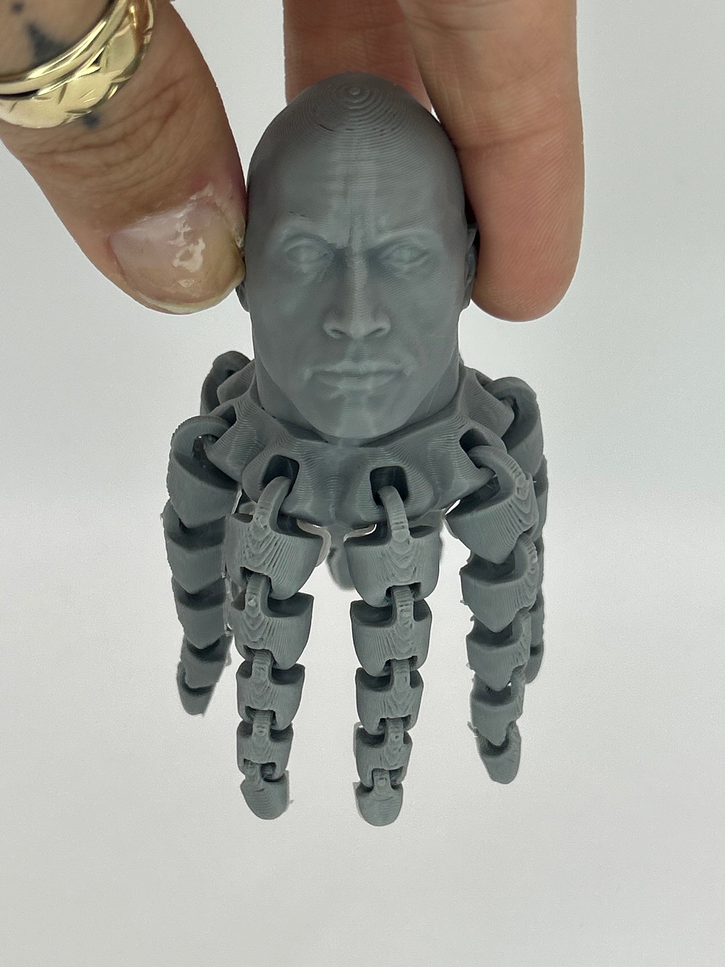 Colorful The Rocktopus fidget clicker desk toy by NiccieNacks, 3D printed octopus with rock-inspired design for stress relief and sensory play.