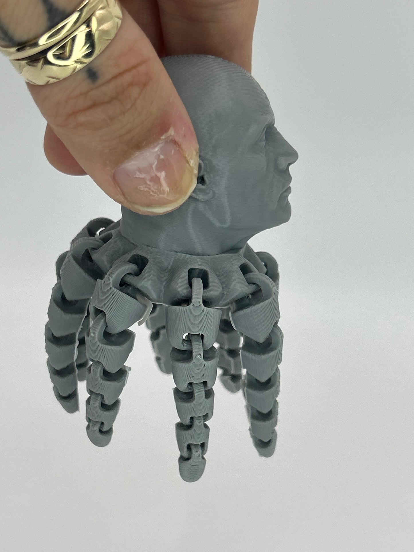 Close-up of NiccieNacks Rocktopus fidget clicker toy, a 3D printed octopus desk toy with textured rock-inspired design.