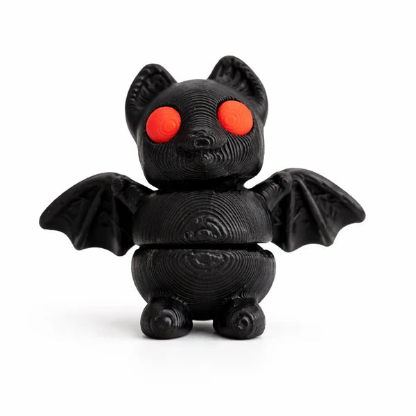 Small articulated Bat Wiggies toy by NiccieNacks featuring a cute bat design with flexible limbs and detailed features.