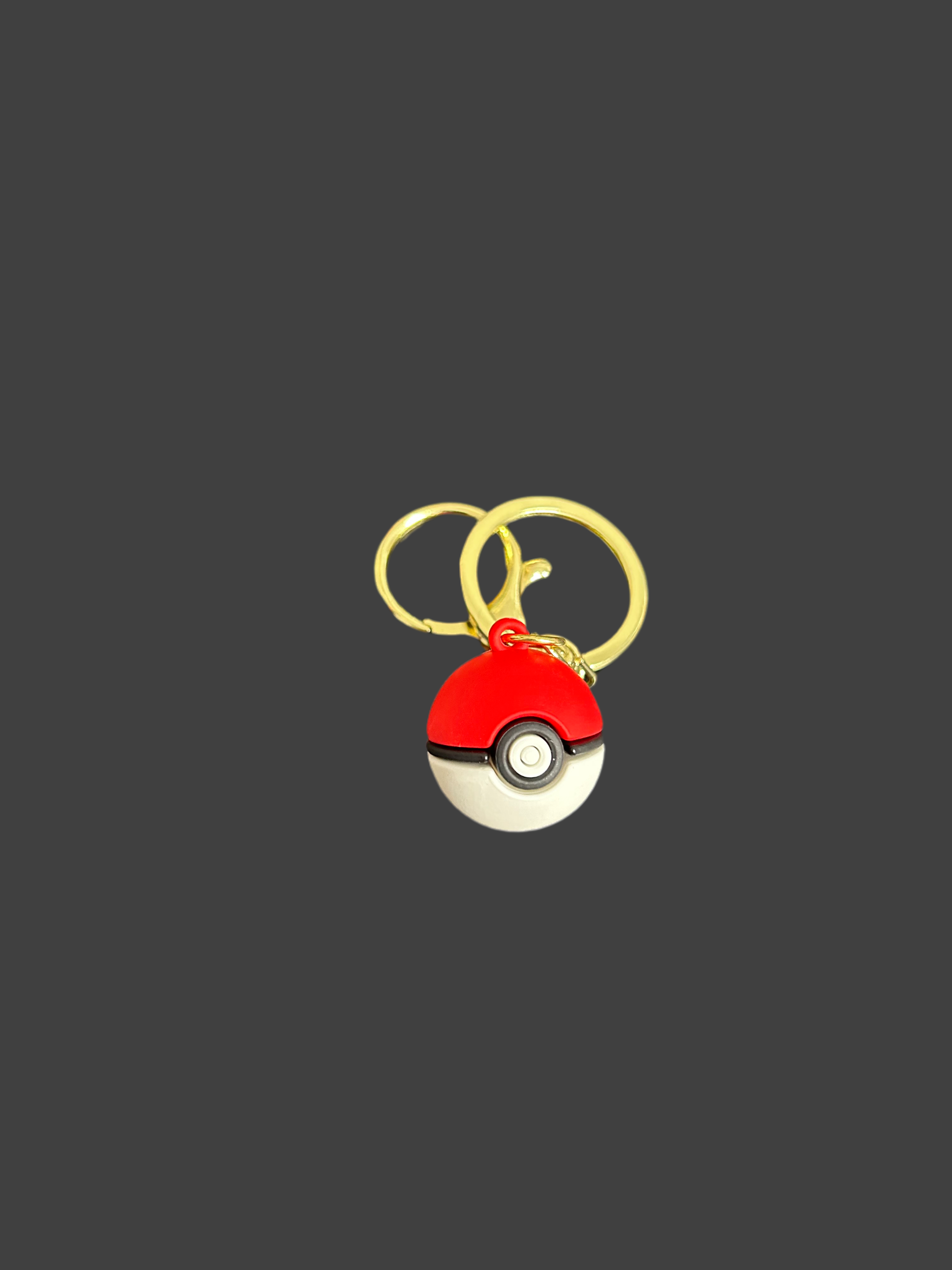 Pokemon Ball keyring by NiccieNacks featuring a red and white spherical design with a metal keyring attachment.