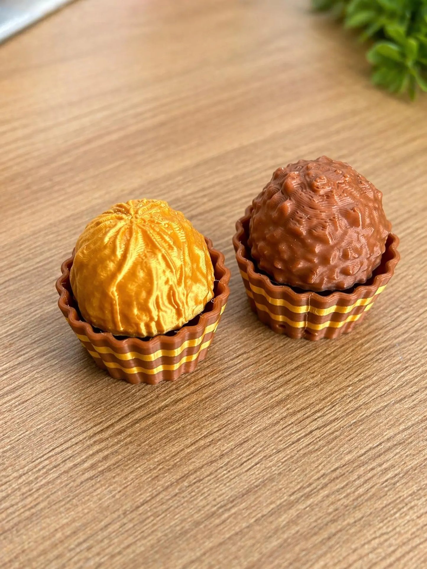 Ferrero Rocher-themed fidget clicker toy by NiccieNacks featuring a chocolate wrapper design and multiple clicker buttons.