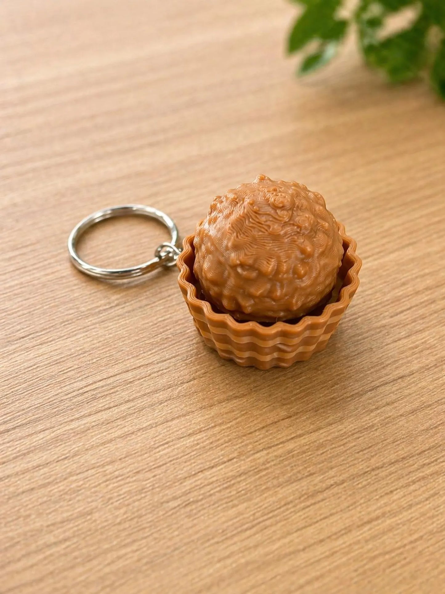 Ferrero Rocher Fidget Toy Clicker by NiccieNacks, a chocolate-inspired plastic fidget clicker with a realistic Ferrero Rocher design.