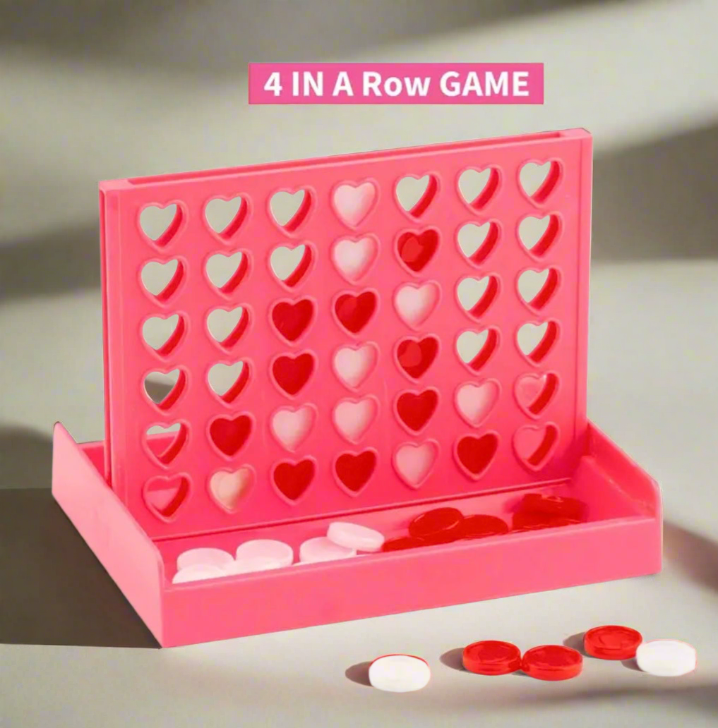 NiccieNacks Heart Four in a Row Travel Game, compact gift set with colorful game pieces on a heart-shaped board.
