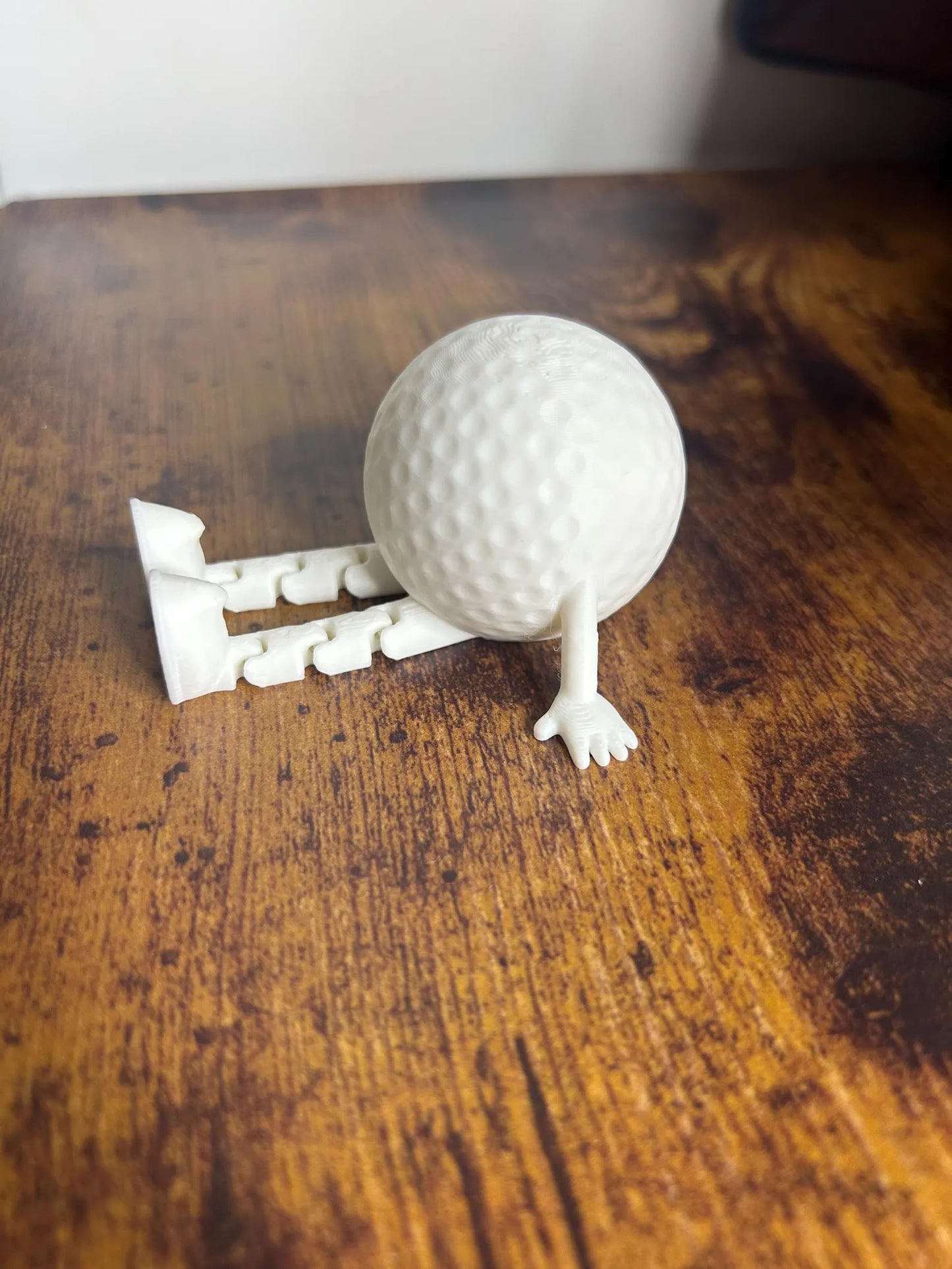 White articulated golf ball buddy toy ornament by NiccieNacks, featuring a playful design perfect for golf enthusiasts or gift-giving.
