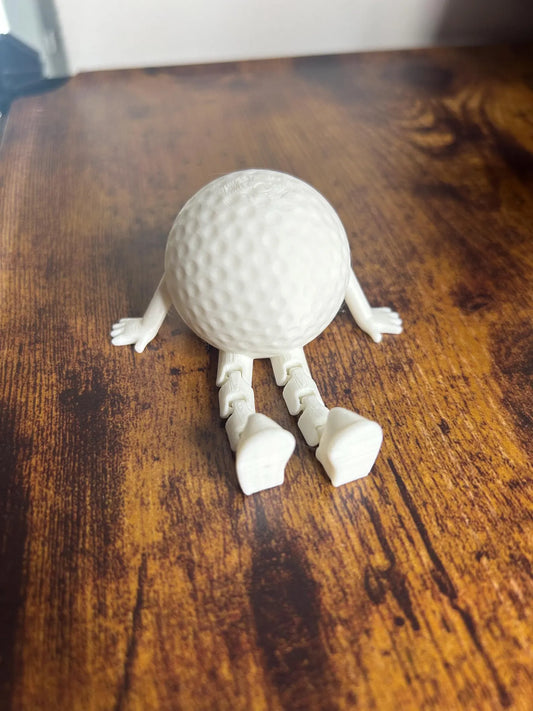 White articulated golf ball buddy toy ornament by NiccieNacks, featuring a playful golf-themed design and detailed craftsmanship.