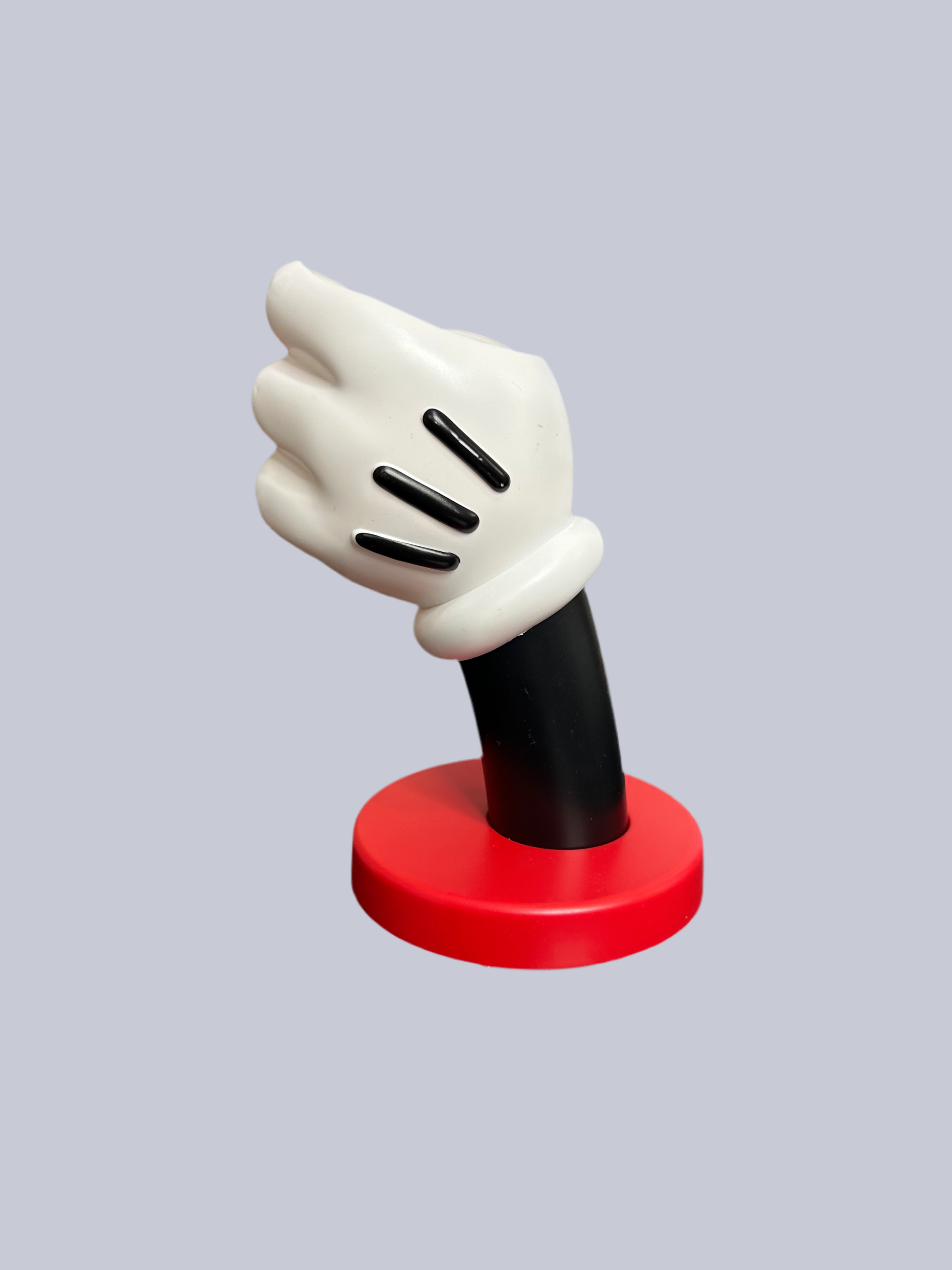 Disney Mickey Mouse glove-shaped ceramic vase with black and white color, styled as a fun home decor piece.