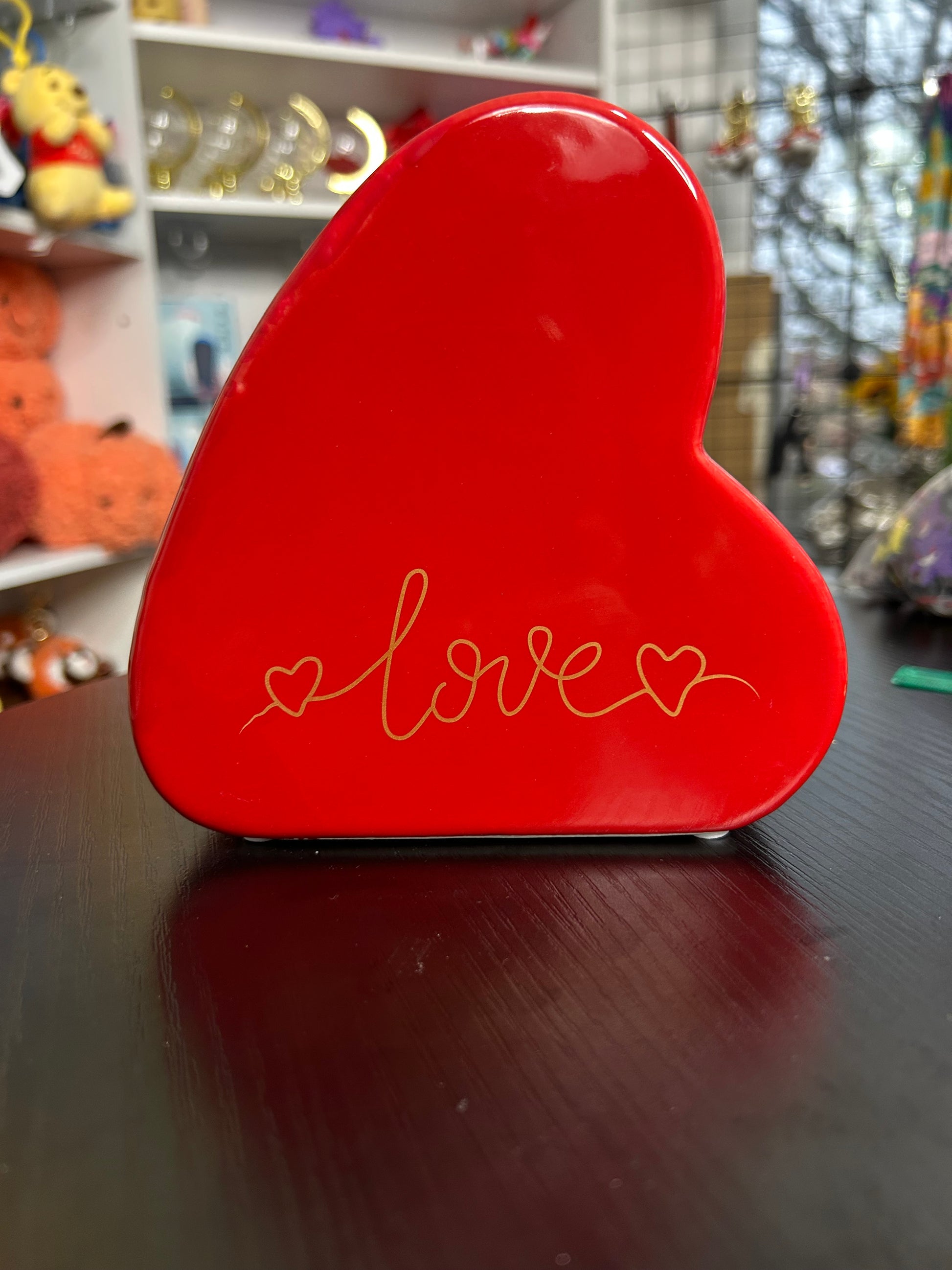 Red love heart ceramic money box from NiccieNacks, featuring a romantic heart shape and glossy finish for home decor.