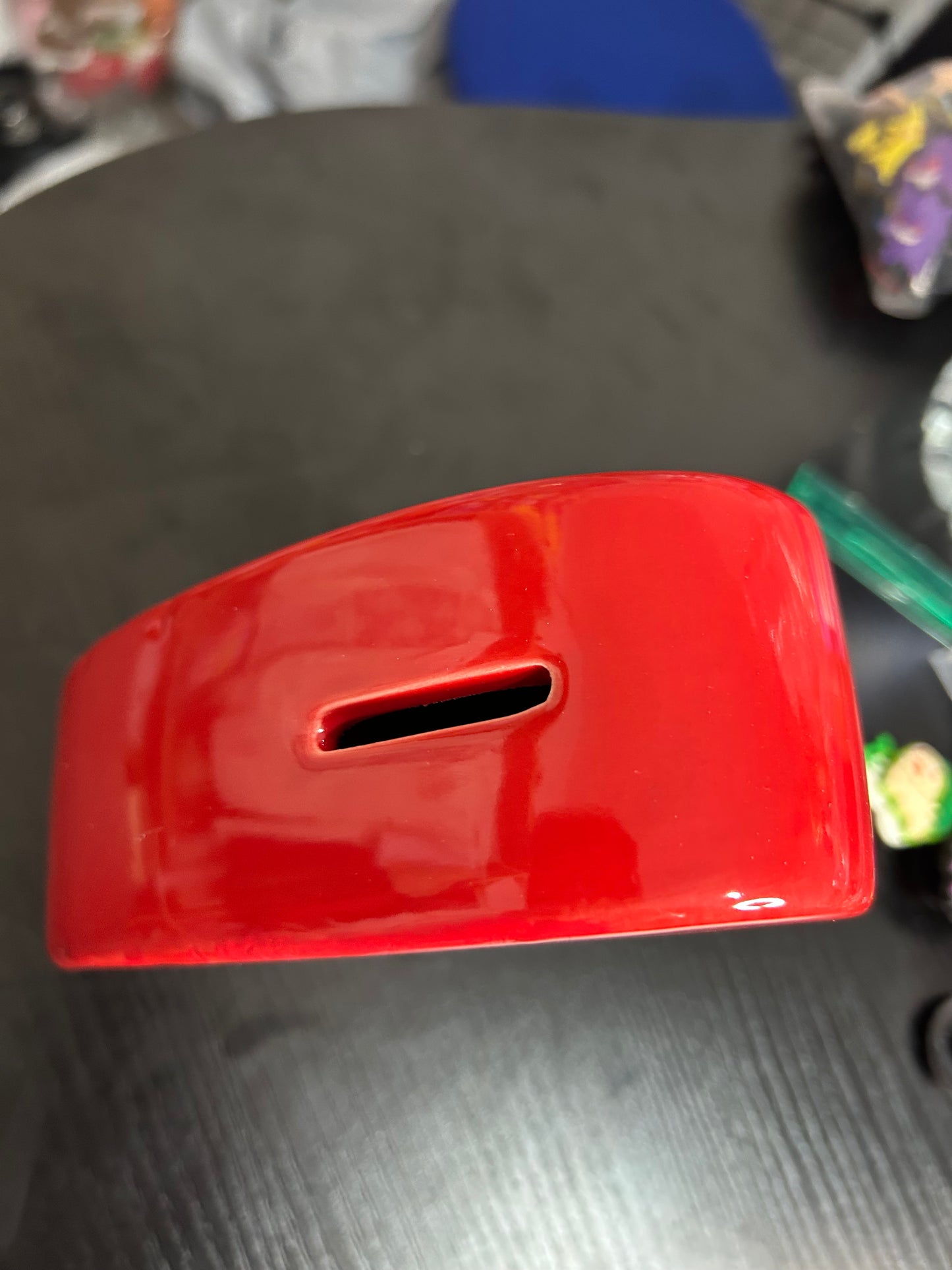 Red love heart ceramic money box from NiccieNacks, featuring a charming heart design for saving coins and cash.