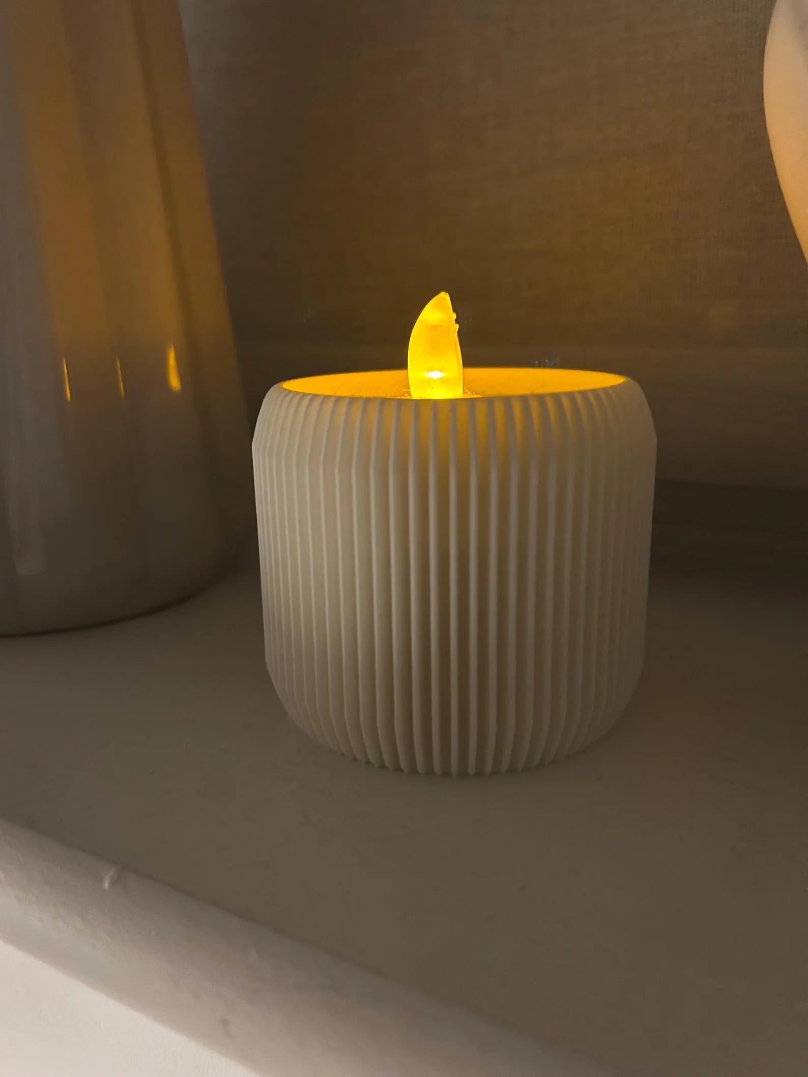 White ridged tealight candle holder from NiccieNacks, designed for home decor with a textured, modern style.