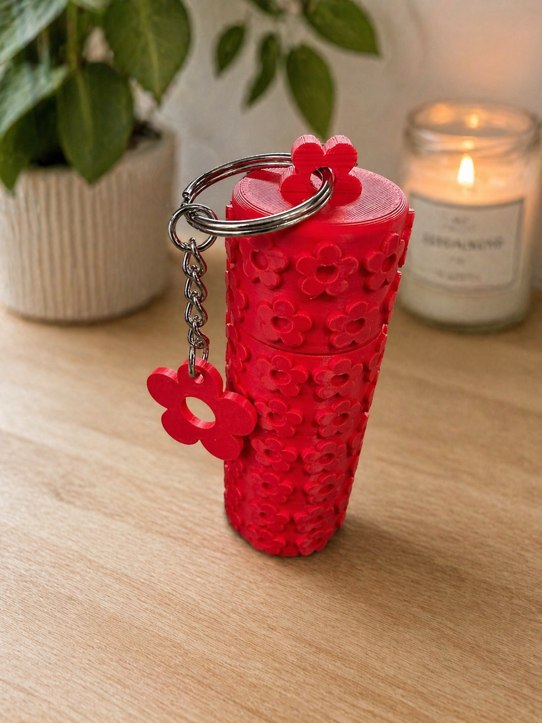 NiccieNacks Little Flower lipstick holder keychain featuring a small, decorative flower design on a metal keychain.