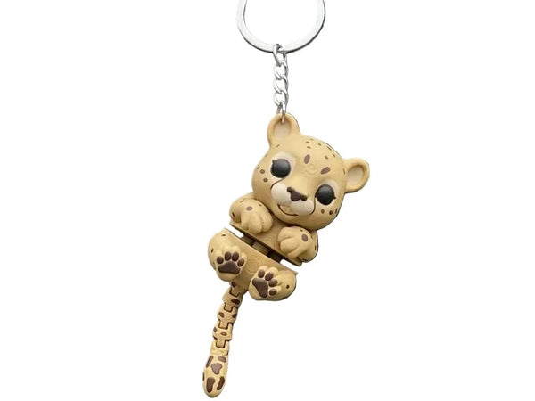 3D printed Flexi Cheetah Cub keychain by NiccieNacks featuring a colorful, flexible cheetah cub figure attached to a keyring.