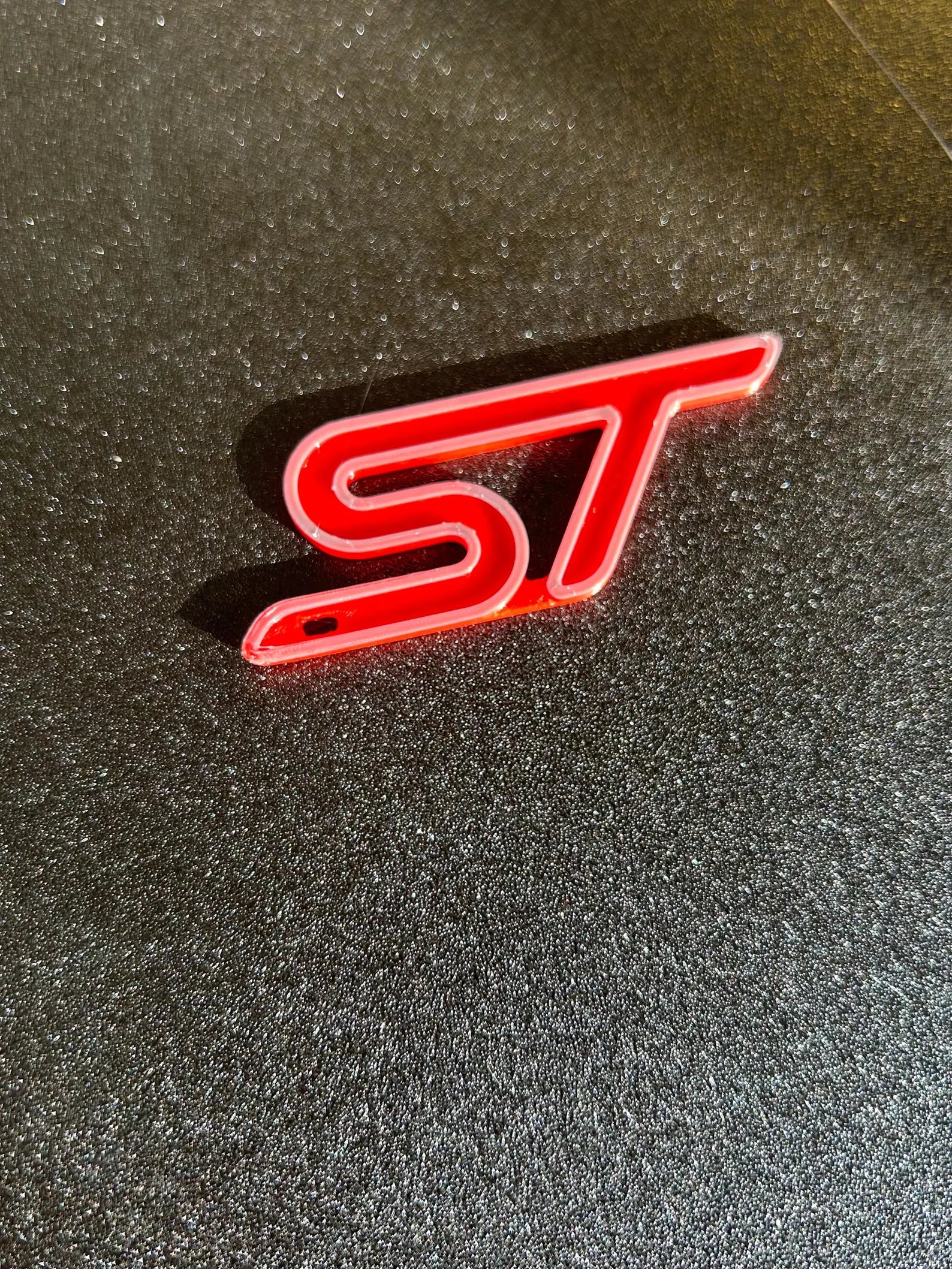 NiccieNacks Ford ST Line logo keychain with branded metal emblem on a keyring, perfect for Ford enthusiasts.