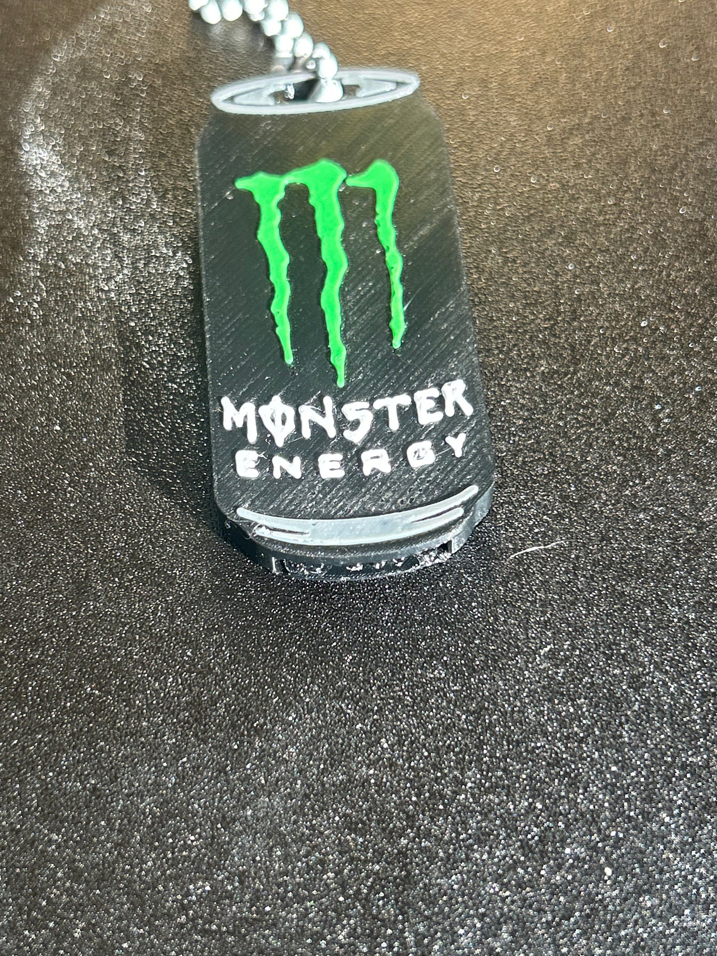 Monster Energy can opener keyring by NiccieNacks, compact metal keychain with Monster Energy logo and can opener tool.