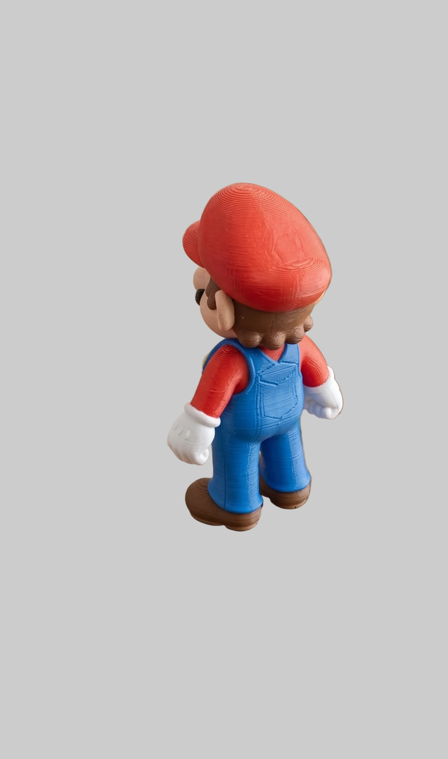 3D printed Super Mario mini figure by NiccieNacks, detailed model of the iconic Nintendo character on a neutral background.