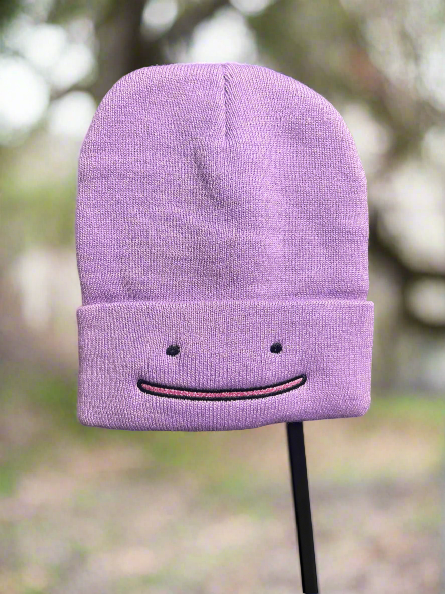 Purple Pokemon Ditto Beanie Hat by NiccieNacks featuring a cute Ditto face design on soft knit fabric.