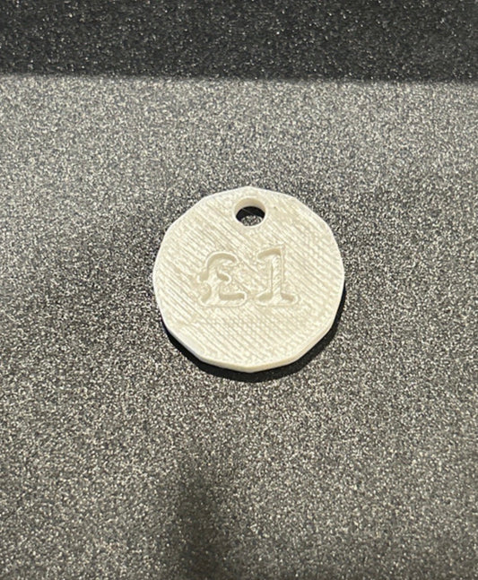 NiccieNacks UK £1 trolley coin token keyring with a circular metal design and keyring attachment, ideal for shopping carts.