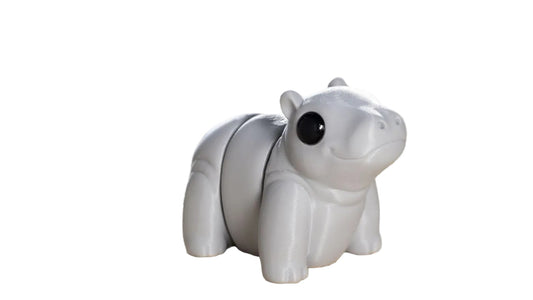 Small articulated Hippo Wiggies toy from NiccieNacks, featuring a cute baby hippo with detailed facial features and soft texture.