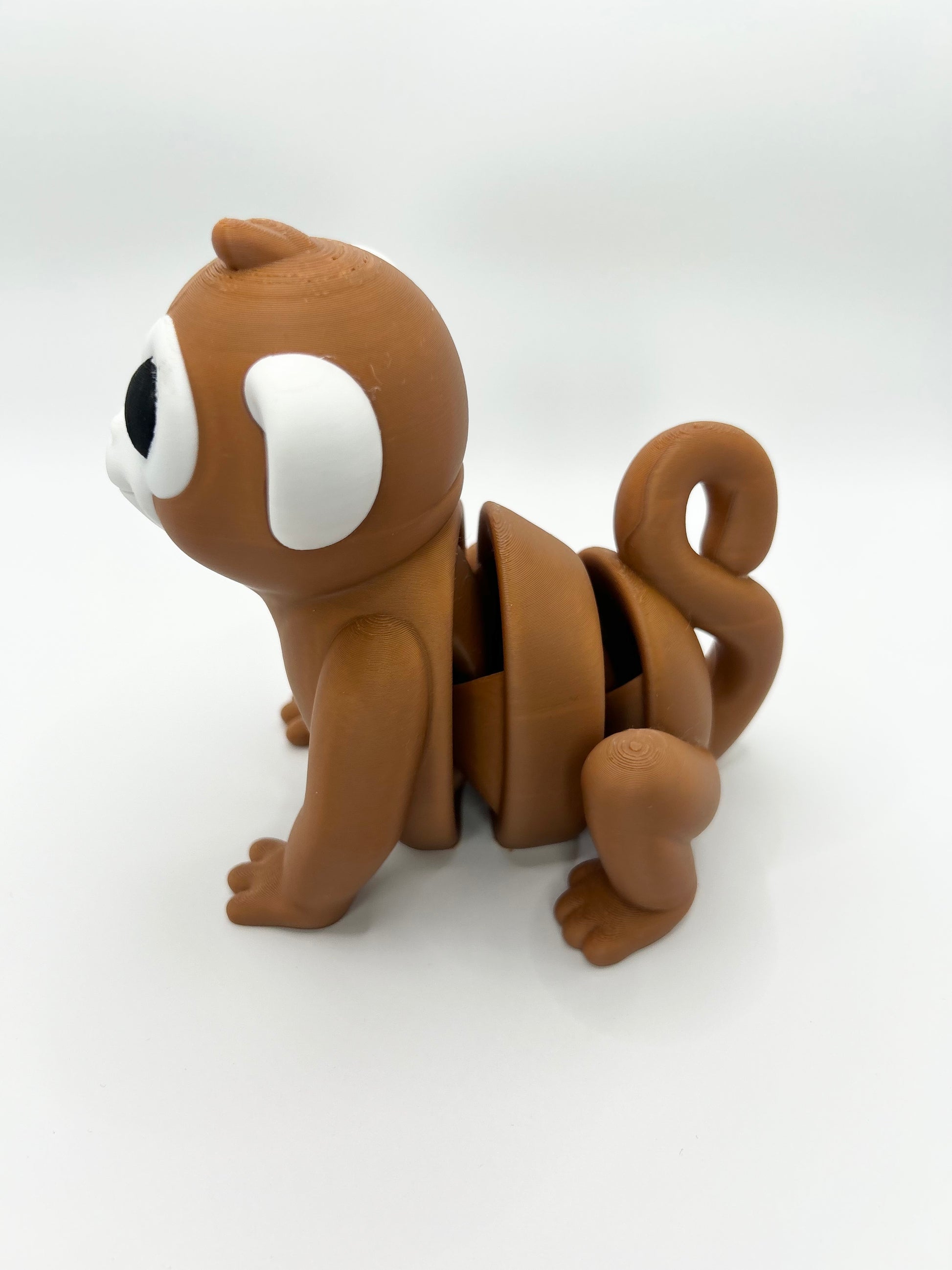 Large articulated Monkey Wiggies toy by NiccieNacks, featuring colorful, flexible limbs and detailed monkey face.