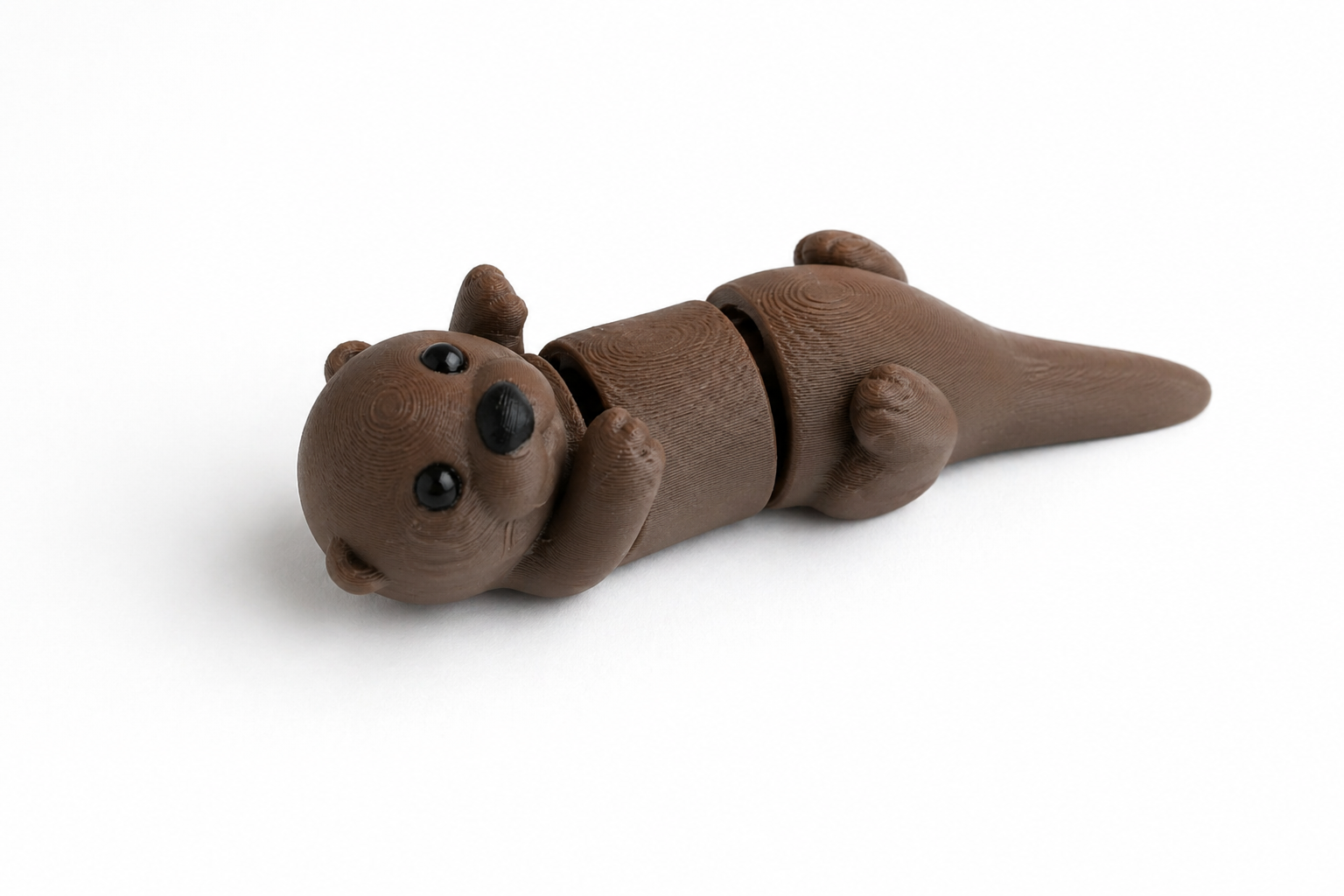 Colorful Otter Small Wiggies articulated toy by NiccieNacks, featuring flexible joints and playful design.