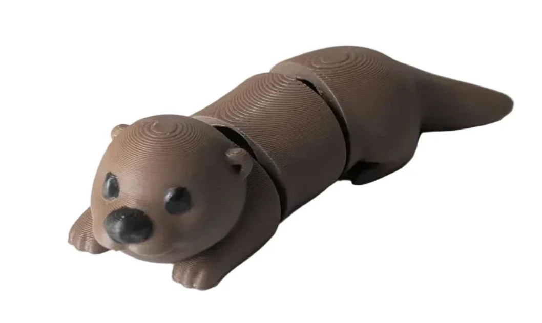 NiccieNacks Otter Wiggies Flexi articulated 3D printed toy with movable limbs and detailed otter design for playful fun.