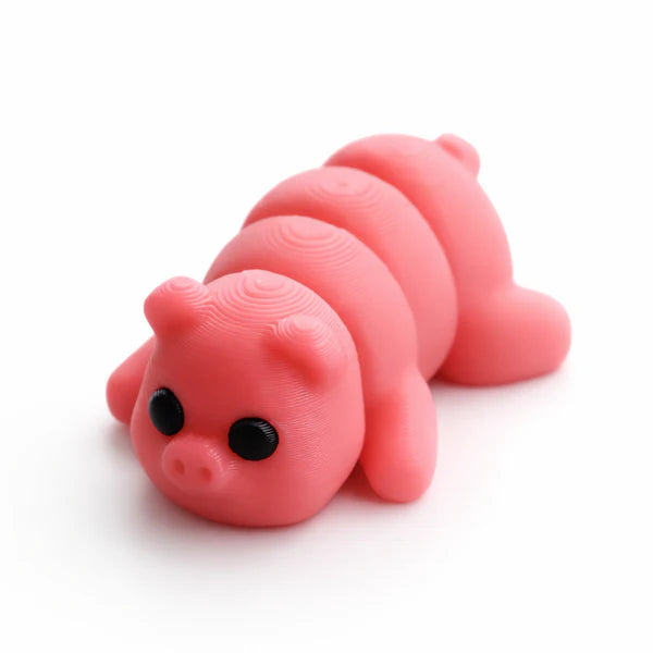 Small Pig Wiggies articulated toy from NiccieNacks featuring a cute pig design with movable limbs for play and display.