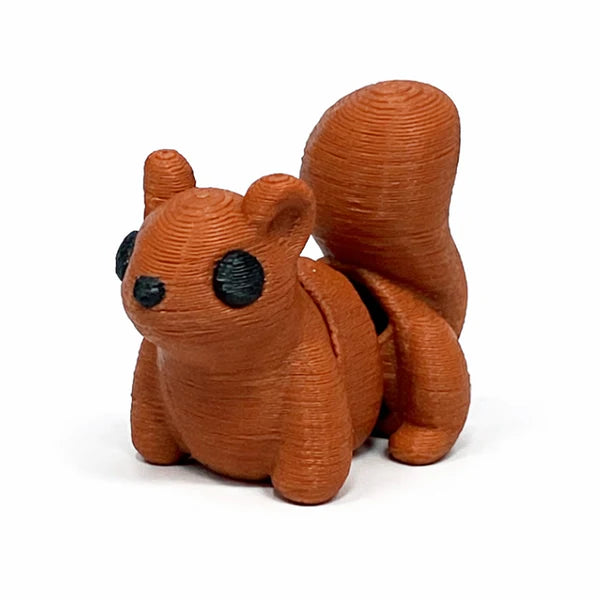 Small articulated squirrel Wiggies toy by NiccieNacks featuring detailed fur texture and flexible limbs.