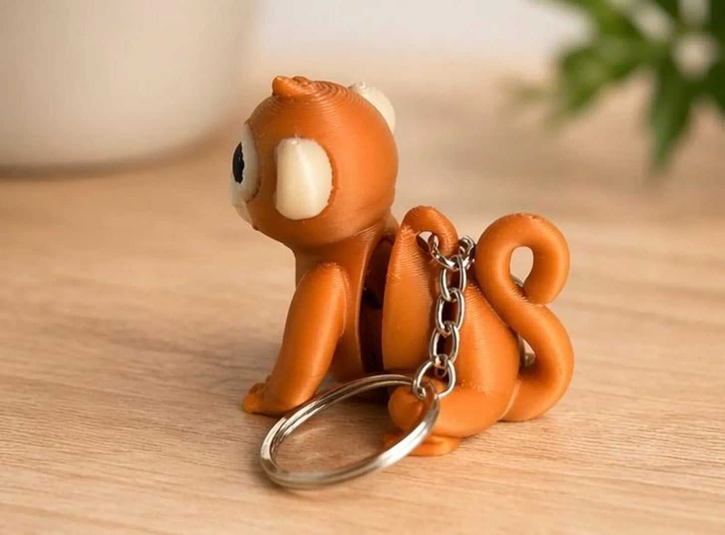 NiccieNacks Monkey Wigglets articulated moving keychain featuring a playful monkey design with flexible, wiggly limbs.